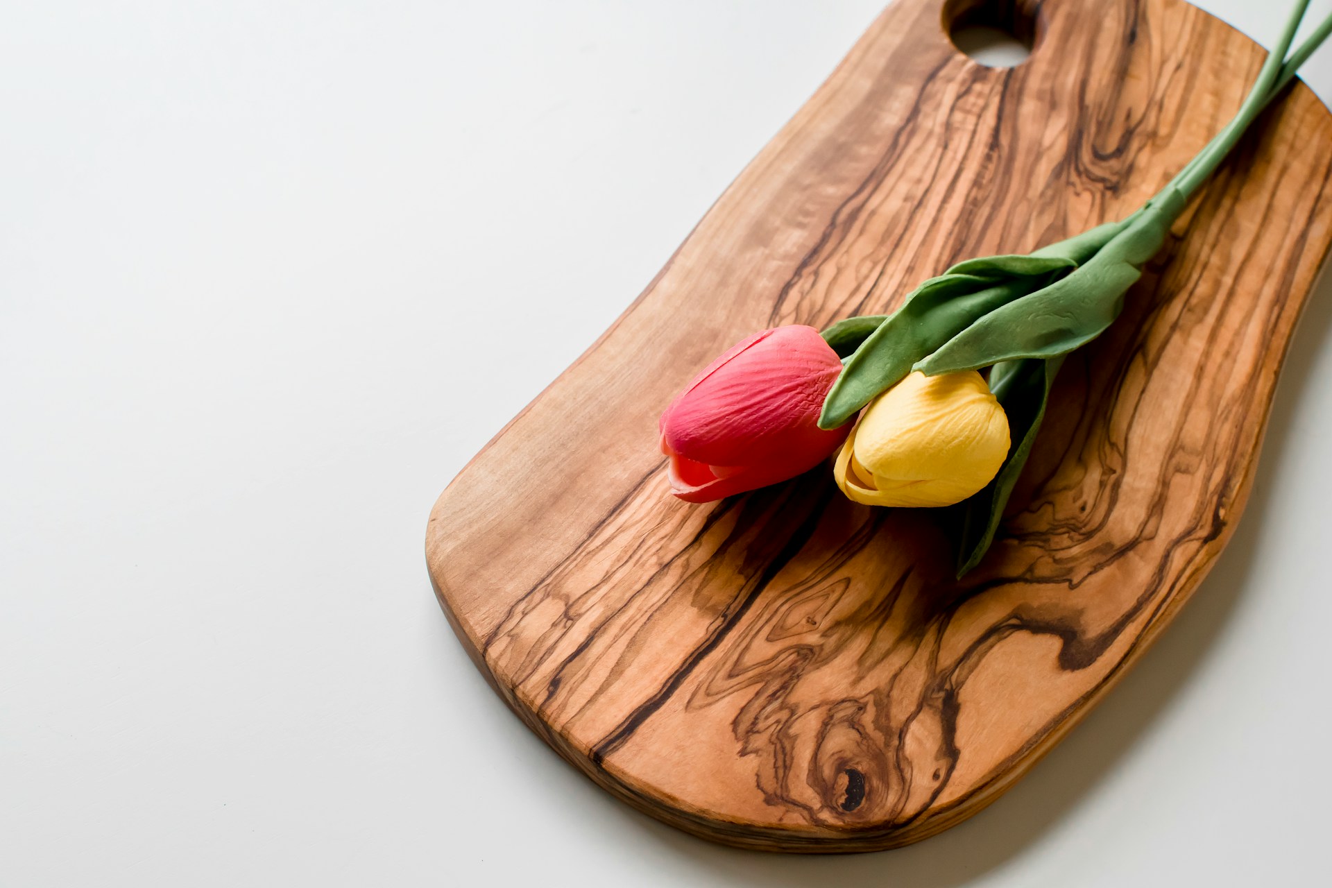 Olive tree wood board with tulips on top