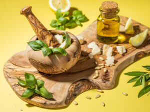 olive wood mortar and pestles on olive wood board